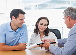 purchase prequalified couple signing papers